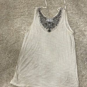 BCBG maxzaria tank with a jeweled chest. Size small but runs big like new.